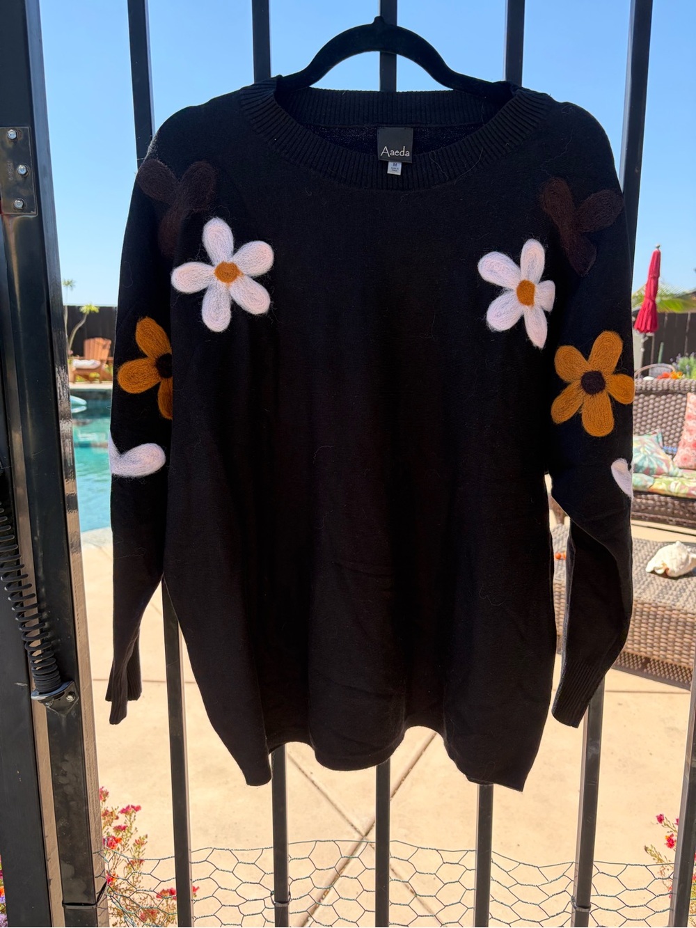 Aaeda Black Crewneck Sweater with White and Mustard Daisy Appliqués